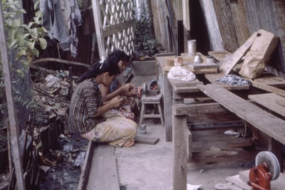 Two women sitting on the floor
